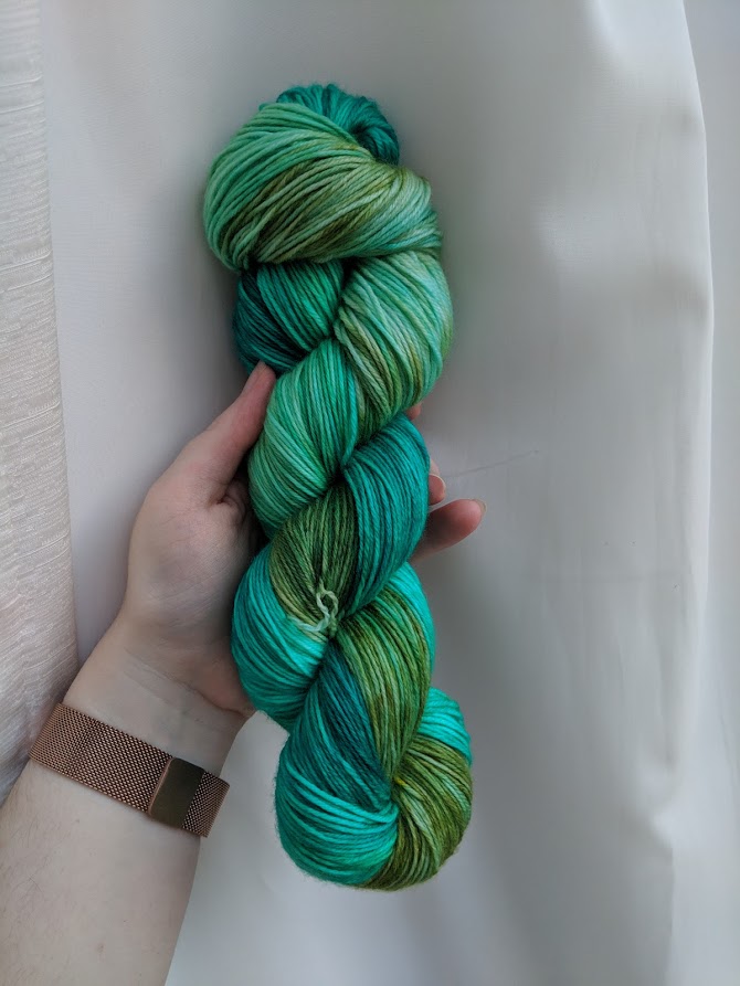 a skein of blue green yarn